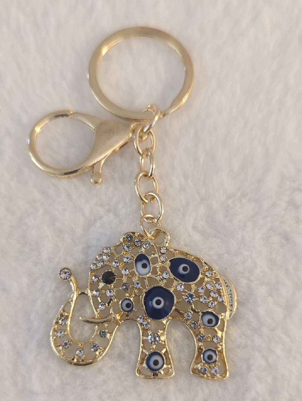 Lucky Gold Elephant Keychain with Blue Eye Accents